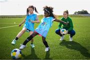 27 August 2021; Republic of Ireland international Emily Whelan with Ellie Collins, left, and Marwa Babiker of St Mochtas FC at the launch of the Disney Playmakers football program at the FAI National Training Centre in Abbotstown, Dublin. Playmakers employs an innovative storytelling approach featuring much-loved Disney characters to help more girls see the fun in regular physical exercise and football. Girls across the Republic of Ireland are being encouraged to kickstart a lifelong love of football through a ground-breaking Playmakers football programme from UEFA and Disney. Photo by Stephen McCarthy/Sportsfile