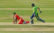 27 August 2021; Richard Ngarava of Zimbabwe runs-out Ireland's Craig Young of Ireland during match one of the Dafanews T20 series between Ireland and Zimbabwe at Clontarf Cricket Club in Dublin. Photo by Seb Daly/Sportsfile