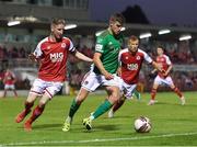 27 August 2021; Darragh Crowley of Cork City in action against Ian Bermingham, left, and Jamie Lennon of St Patrick's Athletic during the extra.ie FAI Cup Second Round match between Cork City and St Patrick's Athletic at Turner's Cross in Cork. Photo by Piaras Ó Mídheach/Sportsfile
