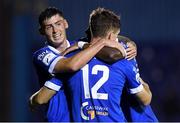 27 August 2021; John Martin, 12, of Waterford is congratulated by team-mates Cian Kavanagh and Prince Mutswunguma after scoring his side's second goal during the extra.ie FAI Cup Second Round match between Waterford and Kilnamanagh at RSC In Waterford. Photo by Matt Browne/Sportsfile