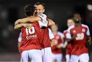 27 August 2021; Alfie Lewis of St Patrick's Athletic, 16, celebrates with team-mate Jamie Lennon after scoring his side's last penalty to win the penalty shoot-out during the extra.ie FAI Cup Second Round match between Cork City and St Patrick's Athletic at Turner's Cross in Cork. Photo by Piaras Ó Mídheach/Sportsfile