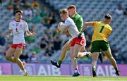28 August 2021; Cormac Devlin of Tyrone gets past Killian Smyth and Oisín McDermott, right, of Meath on his way to scoring his side's first goal during the Electric Ireland GAA Football All-Ireland Minor Championship Final match between Meath and Tyrone at Croke Park in Dublin. Photo by Brendan Moran/Sportsfile
