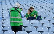 28 August 2021; Meath supporters Carol and Cormack Glennon, from Ballinabrackey, are photographed by photographer John Quirke before the Electric Ireland GAA Football All-Ireland Minor Championship Final match between Meath and Tyrone at Croke Park in Dublin. Photo by Ray McManus/Sportsfile