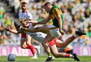 28 August 2021; Seán O'Shea of Kerry has his shot blocked by Michael O'Neill of Tyrone during the GAA Football All-Ireland Senior Championship semi-final match between Kerry and Tyrone at Croke Park in Dublin. Photo by Brendan Moran/Sportsfile