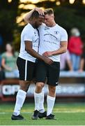 28 August 2021; Sven Biansumba of Maynooth Town, left, celebrates with team-mate Conor Dunne after his shot on goal is deflected in for an own goal during the extra.ie FAI Cup Second Round match between Maynooth University Town and Cobh Ramblers at John Hyland Park in Baldonnell, Dublin. Photo by Eóin Noonan/Sportsfile