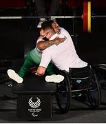 29 August 2021; Britney Arendse of Ireland and coach Roy Guerin embrace after she lifted 107kg in the Women's 73kg final at the Tokyo International Forum on day five during the Tokyo 2020 Paralympic Games in Tokyo, Japan. Photo by David Fitzgerald/Sportsfile