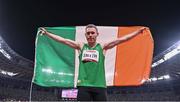 29 August 2021; Jason Smyth of Ireland celebrates with the tricolour after winning the T13 Men's 100 metre final at the Olympic Stadium on day five during the Tokyo 2020 Paralympic Games in Tokyo, Japan. Photo by Sam Barnes/Sportsfile