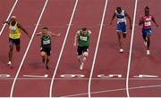 29 August 2021; Jason Smyth of Ireland, centre, crosses the line to win the Men's T13 100 metre final ahead of second place Skander Djamil Athmani of Algeria, second from left, and third place Jean Carlos Mina Aponza of Columbia, left, at the Olympic Stadium on day five during the Tokyo 2020 Paralympic Games in Tokyo, Japan. Photo by David Fitzgerald/Sportsfile