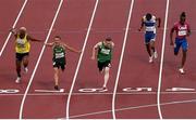 29 August 2021; Jason Smyth of Ireland, centre, crosses the line to win the Men's T13 100 metre final ahead of second place Skander Djamil Athmani of Algeria, second from left, and third place Jean Carlos Mina Aponza of Columbia, left, at the Olympic Stadium on day five during the Tokyo 2020 Paralympic Games in Tokyo, Japan. Photo by David Fitzgerald/Sportsfile