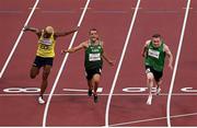 29 August 2021; Jason Smyth of Ireland, right, crosses the line to win the Men's T13 100 metre final ahead of second place Skander Djamil Athmani of Algeria, centre, and third place Jean Carlos Mina Aponza of Columbia at the Olympic Stadium on day five during the Tokyo 2020 Paralympic Games in Tokyo, Japan. Photo by David Fitzgerald/Sportsfile