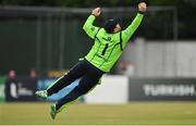 29 August 2021; Paul Stirling of Ireland catches Zimbabwe's Regis Chakabva during match two of the Dafanews T20 series between Ireland and Zimbabwe at Clontarf Cricket Club in Dublin. Photo by Seb Daly/Sportsfile