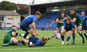 29 August 2021; Hugh Cooney of Leinster scores his side's first try despite the tackle of Jonathon Flynn of Connacht during the IRFU U19 Men’s Clubs Interprovincial Championship Round 2 match between Leinster and Connacht at Energia Park in Dublin. Photo by Harry Murphy/Sportsfile