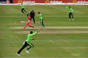 29 August 2021; Ireland players, including Barry McCarthy, Kevin O’Brien of Ireland and Andrew Balbirnie, appeal the run-out of Zimbabwe's Tadiwanashe Marumani, after a direct hit from Harry Tector, bottom, during match two of the Dafanews T20 series between Ireland and Zimbabwe at Clontarf Cricket Club in Dublin. Photo by Seb Daly/Sportsfile