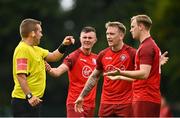 29 August 2021; Killester Donnycarney players Robert Dunne and Mark Ryan protest to referee Kevin O'Sullivan during the extra.ie FAI Cup Second Round match between Killester Donnycarney and Wexford at Hadden Park in Killester, Dublin. Photo by Eóin Noonan/Sportsfile