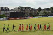 29 August 2021; Players shake hands after match two of the Dafanews T20 series between Ireland and Zimbabwe at Clontarf Cricket Club in Dublin. Photo by Seb Daly/Sportsfile