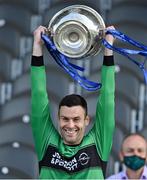 29 August 2021; Nemo Rangers captain Micheal Aodh Martin lifts the cup, watched by his father An Taoiseach Micheál Martin TD, after the 2020 Cork County Senior Club Football Championship Final match between between Castlehaven and Nemo Rangers at Páirc Ui Chaoimh in Cork. Photo by Brendan Moran/Sportsfile