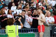 28 August 2021; Cathal McShane of Tyrone poses with supporters for a photograph following the GAA Football All-Ireland Senior Championship semi-final match between Kerry and Tyrone at Croke Park in Dublin. Photo by Stephen McCarthy/Sportsfile
