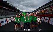 31 August 2021; Katie-George Dunlevy, fourth from left, and Eve McCrystal of Ireland, fourth from right, with head coach Neill Delahaye, centre, and their team celebrate with the Irish tri-colour after the Women's B Time Trial at the Fuji International Speedway on day seven during the Tokyo 2020 Paralympic Games in Shizuoka, Japan. Photo by David Fitzgerald/Sportsfile