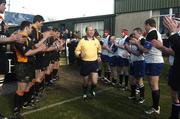 28 February 2004; Cork Constitution and Buccaneers players applaud referee David McHugh as he makes his way onto the pitch, David announced recently he is retiring from Interenational rugby. AIB All Ireland League 2003-2004, Division 1, Cork Constitution v Buccaneers, Temple Hill, Cork. Picture credit; Damien Eagers / SPORTSFILE *EDI*