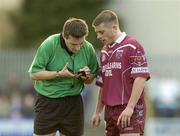 7 March 2004; Referee Maurice Deegan takes the name of Westmeath forward Alan Mangan. Allianz Football League 2004, Division 1A, Round 4, Westmeath v Dublin, Cusack Park, Mullingar, Co. Westmeath. Picture credit; Ray McManus / SPORTSFILE *EDI*