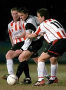 10 March 2004; Martin Reilly, Kildare County, in action against Mark McCrystal and Eamon Doherty, Derry City.  Pre-Season friendly, Kildare County v Derry City, Station Road, Kildare. Picture credit; David Maher / SPORTSFILE *EDI*
