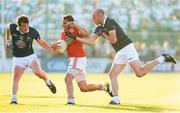 20 July 2013; Mark Donnelly, Tyrone, in action against Paddy Brophy, left, and Hugh McGrillen, Kildare. GAA Football All-Ireland Senior Championship, Round 3, Kildare v Tyrone, St Conleth's Park, Newbridge, Co. Kildare. Picture credit: Stephen McCarthy / SPORTSFILE