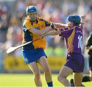 20 July 2013; Maire McGrath, Clare, in action against Josie Dwyer, Wexford. Liberty Insurance Senior Camogie Championship Group 1, Wexford v Clare, Wexford Park, Wexford Picture credit: David Maher / SPORTSFILE