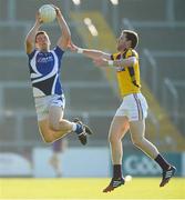 20 July 2013; John O'Loughlin, Laois, in action against Rory Quinlivan, Wexford. GAA Football All-Ireland Senior Championship Round 3, Wexford v Laois, Wexford Park, Wexford. Picture credit: David Maher / SPORTSFILE
