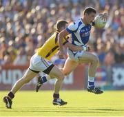 20 July 2013; John O'Loughlin, Laois, in action against David Murphy, Wexford. GAA Football All-Ireland Senior Championship Round 3, Wexford v Laois, Wexford Park, Wexford. Picture credit: David Maher / SPORTSFILE