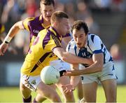 20 July 2013; Conor Meredith, Laois, in action against Aindreas Doyle, Wexford. GAA Football All-Ireland Senior Championship Round 3, Wexford v Laois, Wexford Park, Wexford. Picture credit: David Maher / SPORTSFILE