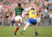 21 July 2013; Conor Loftus, Mayo, has his kick blocked down by Cathal Compton, Roscommon. Electric Ireland Connacht GAA Football Minor Championship Final, Roscommon v Mayo, Elverys MacHale Park, Castlebar, Co. Mayo. Picture credit: Stephen McCarthy / SPORTSFILE