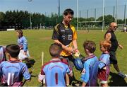 20 July 2013; Opel Kit for Clubs Ambassadors Michael Darragh Macauley, Ciaran Kilkenny and Jackie Tyrrell, supporting the Opel Kit for Clubs Blitz Day in Lucan Sarsfields GAA Club, Lucan. Dublin footballer Michael Darragh Macauley signs autographs for players from Liffey Gaels GAA Club. For every test drive, car service or Opel purchase made through the Opel dealer network, your local GAA club is awarded points. Build up your points and redeem them against high quality kit for your club! Log onto opelkitforclubs.com http://opelkitforclubs.com and start earning points today. Support your local GAA club! Lucan Sarsfields GAA Club, Dublin. Picture credit: Pat Murphy / SPORTSFILE