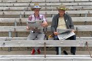 21 July 2013; Brothers Michael McVicar, from Emyvale, Co. Monaghan, left, and Patsy McVicar, from Falcarrigh, Co. Donegal, read the papers ahead of the match. Ulster GAA Football Senior Championship Final, Donegal v Monaghan, St Tiernach's Park, Clones, Co. Monaghan. Picture credit: Brian Lawless / SPORTSFILE