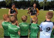20 July 2013; Opel Kit for Clubs Ambassadors Michael Darragh Macauley, Ciaran Kilkenny and Jackie Tyrrell, supporting the Opel Kit for Clubs Blitz Day in Lucan Sarsfields GAA Club, Lucan. Dublin footballers Ciaran Kilkenny, left, and Michael Darragh Macauley speaks to players from Lucan Sarsfields GAA Club during the skills session. For every test drive, car service or Opel purchase made through the Opel dealer network, your local GAA club is awarded points. Build up your points and redeem them against high quality kit for your club! Log onto opelkitforclubs.com http://opelkitforclubs.com and start earning points today. Support your local GAA club! Lucan Sarsfields GAA Club, Dublin. Picture credit: Pat Murphy / SPORTSFILE