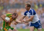 21 July 2013; Neil Gallagher, Donegal, in action against Owen Lennon, Monaghan. Ulster GAA Football Senior Championship Final, Donegal v Monaghan, St Tiernach's Park, Clones, Co. Monaghan. Picture credit: Oliver McVeigh / SPORTSFILE