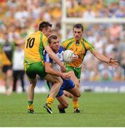 21 July 2013; Padraig Donaghy, Monaghan, in action against David Walsh, left, and Paddy McGrath, Donegal. Ulster GAA Football Senior Championship Final, Donegal v Monaghan, St Tiernach's Park, Clones, Co. Monaghan. Picture credit: Daire Brennan / SPORTSFILE