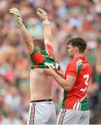 21 July 2013; Mayo goalkeeper Rob Hennelly is assisted by full-back Ger Cafferkey in a change of jersey during the first half. Connacht GAA Football Senior Championship Final, Mayo v London, Elverys MacHale Park, Castlebar, Co. Mayo. Picture credit: Stephen McCarthy / SPORTSFILE