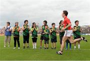 21 July 2013; Members of the Souel Gaels GAA club, South Korea, who took part in a pre-match exhibition game, applaud the Mayo team arrival ahead of the game. Connacht GAA Football Senior Championship Final, Mayo v London, Elverys MacHale Park, Castlebar, Co. Mayo. Picture credit: Stephen McCarthy / SPORTSFILE