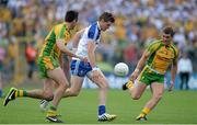 21 July 2013; Darren Hughes, Monaghan, in action against Rory Kavanagh, left, and Paddy McGrath, Donegal. Ulster GAA Football Senior Championship Final, Donegal v Monaghan, St Tiernach's Park, Clones, Co. Monaghan. Picture credit: Brian Lawless / SPORTSFILE