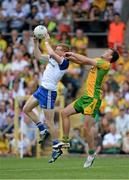 21 July 2013; Kieran Hughes, Monaghan, in action against Eamonn McGee, Donegal. Ulster GAA Football Senior Championship Final, Donegal v Monaghan, St Tiernach's Park, Clones, Co. Monaghan. Picture credit: Brian Lawless / SPORTSFILE