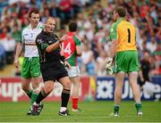 21 July 2013; Referee Conor Lane cautions London goalkeeper Declan Traynor for continuously taking quick kick outs. Connacht GAA Football Senior Championship Final, Mayo v London, Elverys MacHale Park, Castlebar, Co. Mayo. Picture credit: Ray McManus / SPORTSFILE