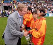21 July 2013; An Taoiseach Enda Kenny, T.D., speaking to Irene Yoon Young Na, a memberof the Souel Gaels GAA club, South Korea, who played in a pre-match exhibition game. Connacht GAA Football Senior Championship Final, Mayo v London, Elverys MacHale Park, Castlebar, Co. Mayo. Picture credit: Ray McManus / SPORTSFILE