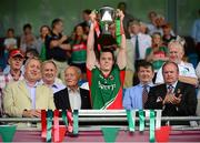 21 July 2013; Mayo captain Stephen Coen lifts the cup in the company of Uachtarán Chumann Lúthchleas Gael Liam Ó Néill and  Kevin Molloy, CRM, Electric Ireland. Roscommon. Electric Ireland Connacht GAA Football Minor Championship Final, Roscommon v Mayo, Elverys MacHale Park, Castlebar, Co. Mayo. Picture credit: Ray McManus / SPORTSFILE