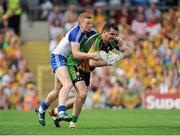 21 July 2013; Paul Durcan, Donegal, in action against Kieran Hughes, Monaghan. Ulster GAA Football Senior Championship Final, Donegal v Monaghan, St Tiernach's Park, Clones, Co. Monaghan. Picture credit: Daire Brennan / SPORTSFILE