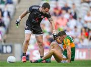 28 August 2021; Tyrone goalkeeper Niall Morgan helps David Clifford of Kerry with an injury during the GAA Football All-Ireland Senior Championship semi-final match between Kerry and Tyrone at Croke Park in Dublin. Photo by Piaras Ó Mídheach/Sportsfile