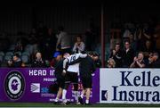 27 August 2021; Wilfred Zahibo of Dundalk is assisted off the pitch after picking up an injury during the extra.ie FAI Cup second round match between Dundalk and St Mochta's at Oriel Park in Dundalk. Photo by Ben McShane/Sportsfile