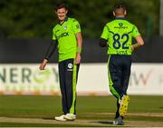 1 September 2021; Mark Adair of Ireland, left celebrates the wicket of Luke Jongwe of Zimbabwe with Josh Little during match three of the Dafanews T20 series between Ireland and Zimbabwe at Bready Cricket Club in Magheramason, Tyrone. Photo by Harry Murphy/Sportsfile