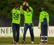 1 September 2021; Ireland players, from left, Shane Getkate, Ben White and Neil Rock celebrate the wicket of Craig Ervine of Zimbabwe during match three of the Dafanews T20 series between Ireland and Zimbabwe at Bready Cricket Club in Magheramason, Tyrone. Photo by Harry Murphy/Sportsfile