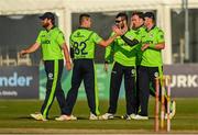 1 September 2021; Ireland players celebrate after the match three of the Dafanews T20 series between Ireland and Zimbabwe at Bready Cricket Club in Magheramason, Tyrone. Photo by Harry Murphy/Sportsfile