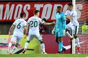 1 September 2021; Republic of Ireland goalkeeper Gavin Bazunu is congratulated by his team-mates after saving the penalty of Cristiano Ronaldo of Portugal during the FIFA World Cup 2022 qualifying group A match between Portugal and Republic of Ireland at Estádio Algarve in Faro, Portugal. Photo by Stephen McCarthy/Sportsfile